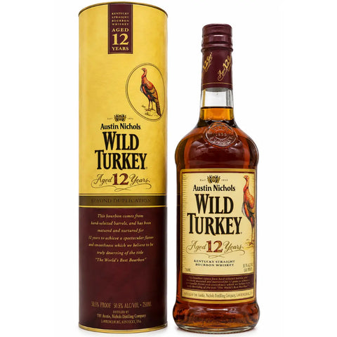 A bottle and cylindrical box of Wild Turkey Beyond Duplication 12 Year Old Kentucky Straight Bourbon Whiskey (approx. 2005–2010), both adorned with a wild turkey illustration and gold accents, make this vintage release from Wild Turkey a true collector’s item.