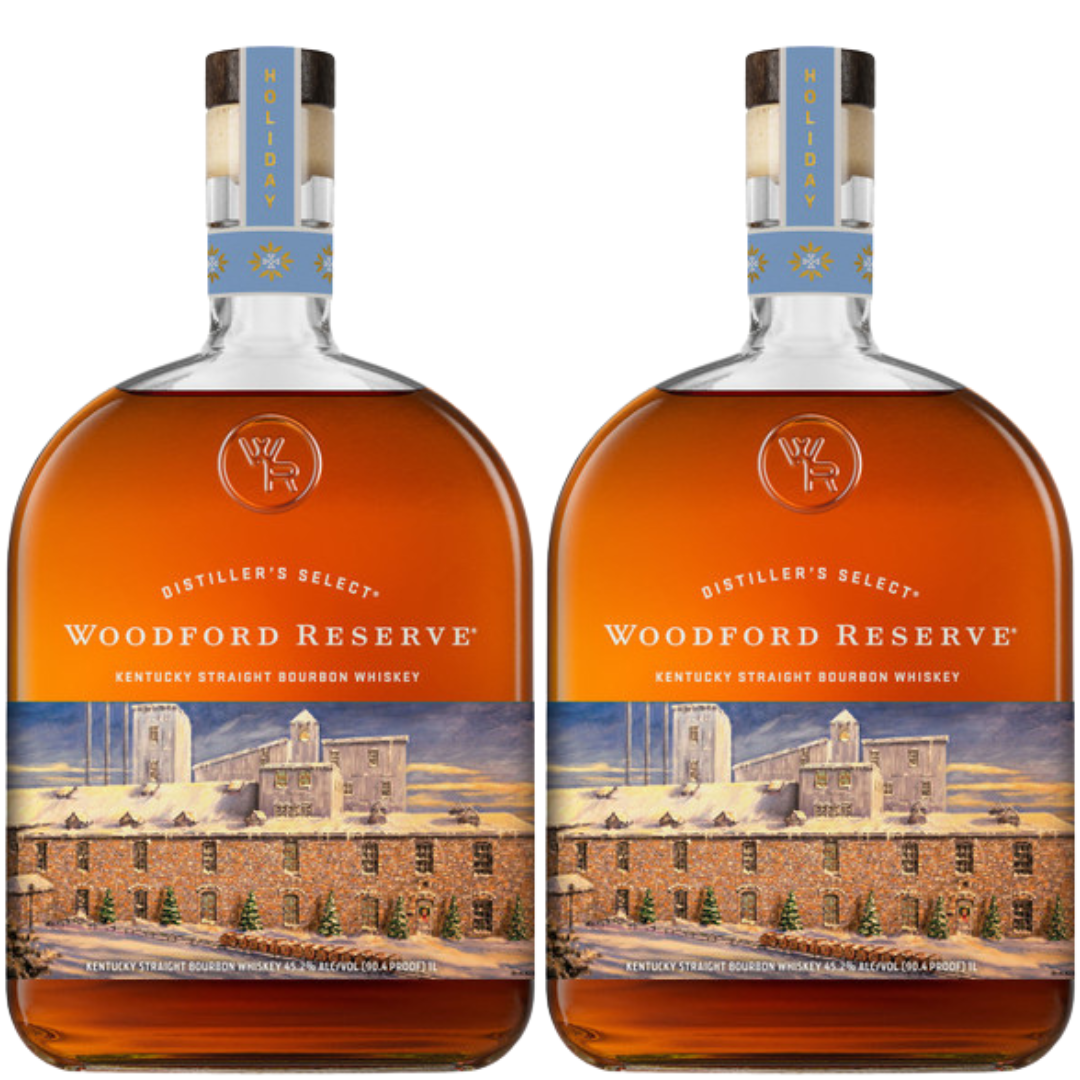 Two bottles of Woodford Reserve Bourbon Holiday Edition 2026 750ml, with a distillery illustration and light blue festive neck labels, are placed side by side.