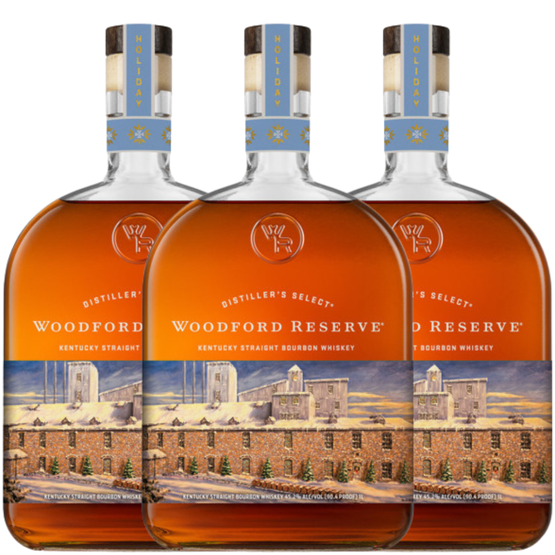 Three bottles of Woodford Reserve are lined up, featuring the Woodford Reserve Bourbon Holiday Edition 2026 750ml with festive labels and a distillery illustration.