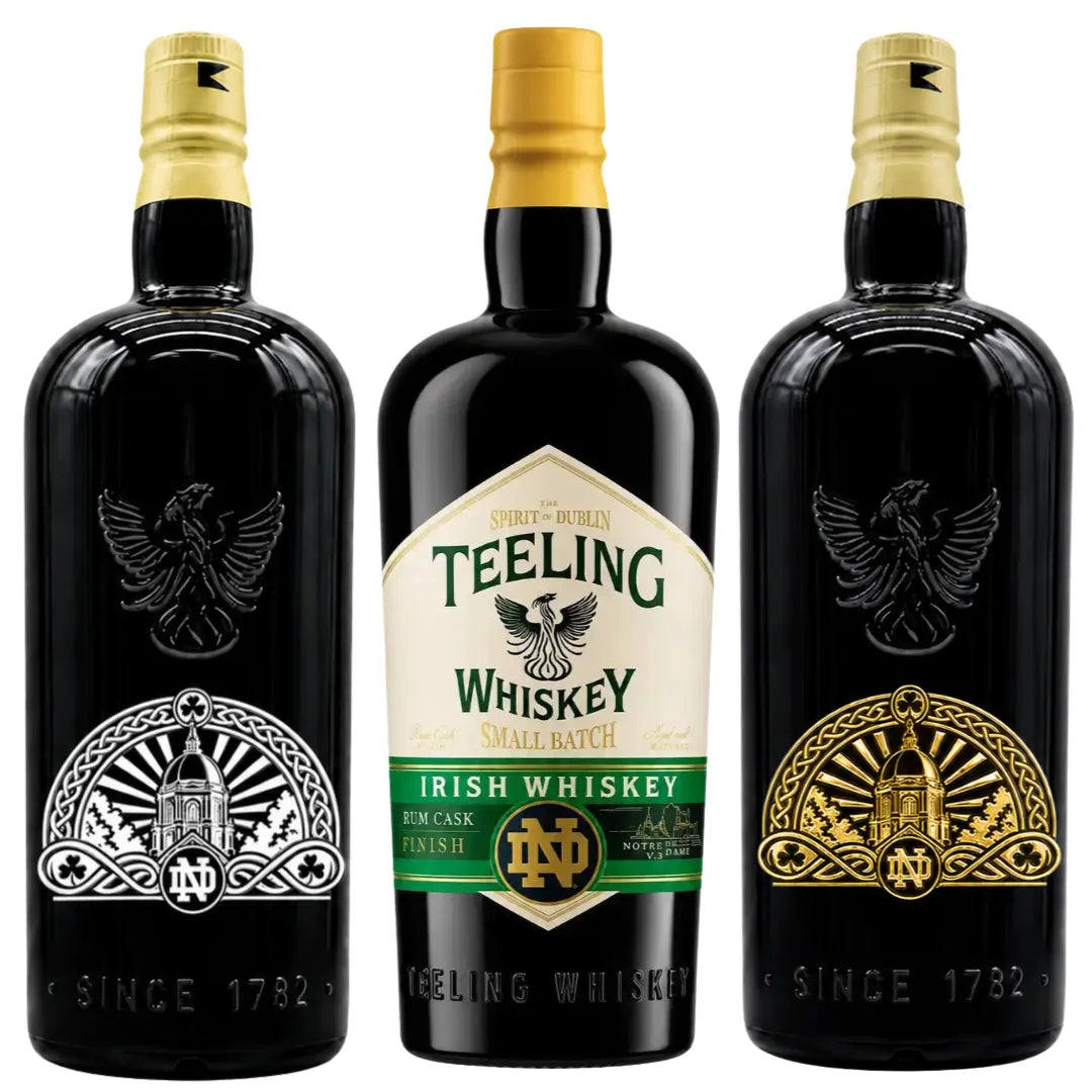 Three bottles from the Teeling x Notre Dame 2026 Custom Deep Etched Irish Whiskey Heritage Bundle by Teeling Whiskey are displayed; the center bottle showcases a detailed label, while the two side bottles feature deep etched Notre Dame Heritage logos in gold and silver with an eagle emblem.