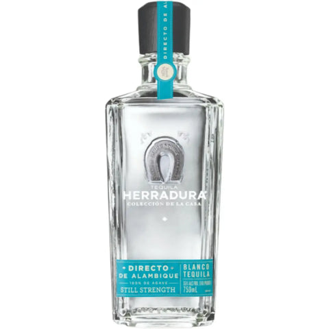 A clear 750ml glass bottle of Herradura Tequila’s 2027 Limited Edition Directo de Alambique Blanco, crafted from 100% Blue Weber agave, features turquoise and silver labels adorned with a horseshoe emblem. This high-proof blanco tequila delivers an authentic expression for discerning enthusiasts.