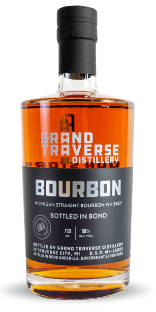 A bottle of Grand Traverse Distillery Bottled in Bond Michigan Straight Bourbon Whiskey with a black and orange label, 750 ml, 50% Alc./Vol., from Grand Traverse Distillery.