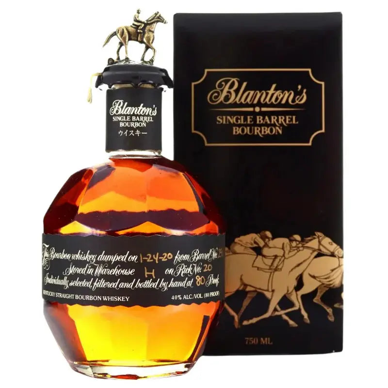A 750ml bottle of Blanton's Black Label Japanese Edition Single Barrel Bourbon from Blanton's Bourbon stands before its black and gold box, featuring horse racing art and topped with the signature horse-and-jockey stopper.