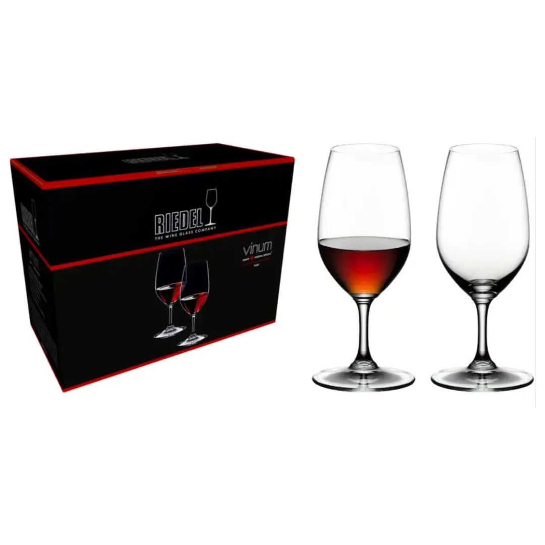A box labeled "RIEDEL Wine Glass Vinum Port Set of 2" by Riedel is placed next to two elegant crystal stemware glasses—one filled with red wine and the other empty—set against a pristine white background.