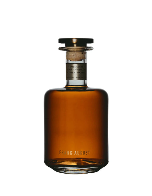 A short, wide glass bottle of Frank August Case Study 08 Winter Wheated Reserve Straight Bourbon Whiskey with a dark stopper and a small rectangular label.