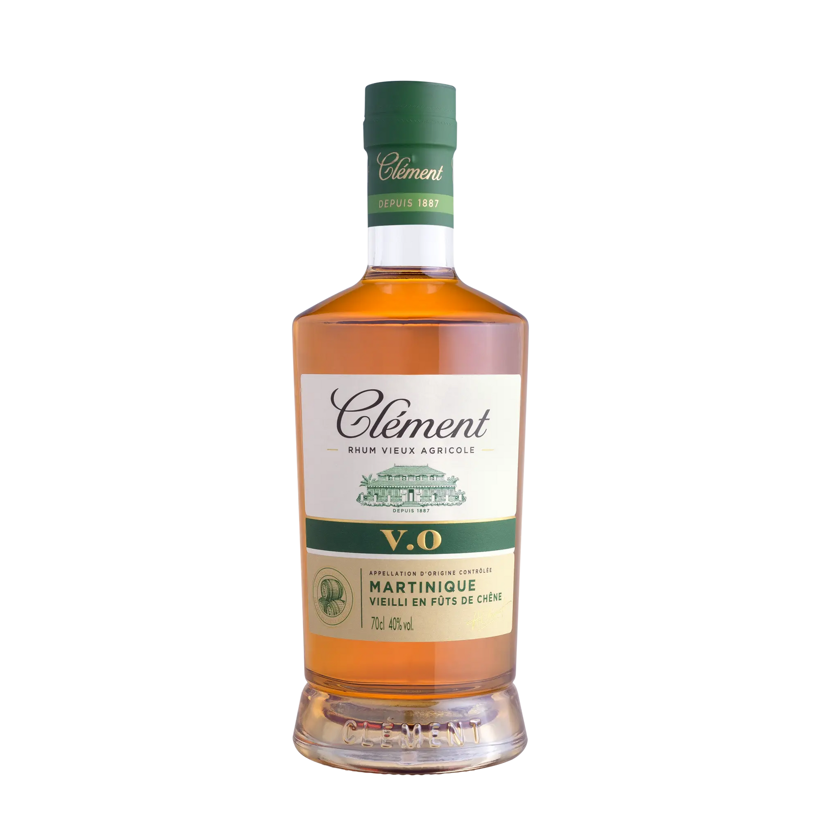 A bottle of Rhum Clément V.O from Martinique with a green cap, amber liquid, and a white label—crafted from sugarcane juice for an authentic Martinique rum experience.