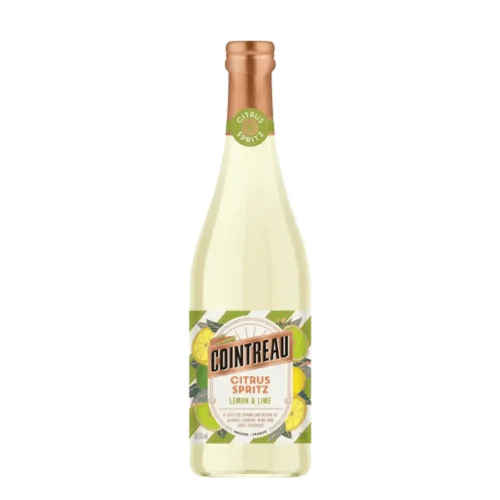 Cointreau Citrus Spritz Lemon & Lime by Cointreau comes in a pale yellow beverage, with a copper-colored cap and a label featuring green leaves and citrus fruit illustrations.