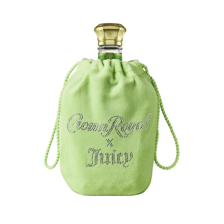 The Crown Royal Regal Apple x Juicy Couture Limited Edition comes in a light green velvet bag with rhinestone-style “Crown Royal x Juicy” lettering and a gold bottle cap, celebrating this unique collaboration.