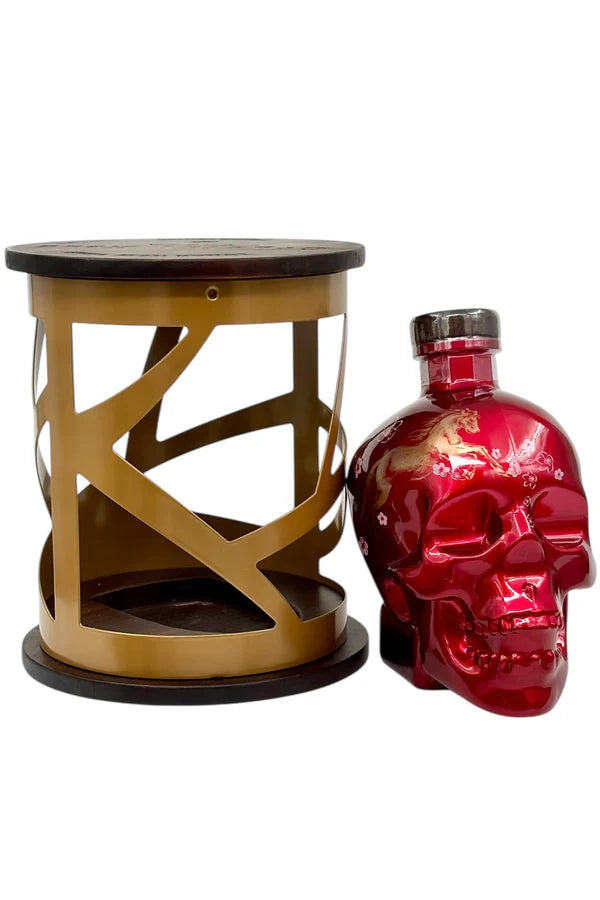 A striking red Crystal Head Vodka Year of the Horse 2026 Lunar New Year Limited Edition skull bottle with a silver cap is paired with a gold and black lantern-style display—perfect for collectors and fans of unique spirits.