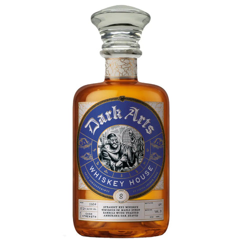 A bottle of Dark Arts Ripple Rye Volume 3 8 Year Straight Rye Whiskey with a blue circular label featuring an illustration of a monk holding a glass, labeled 8 years aged, straight rye whiskey finished in maple syrup barrels and amburana oak.