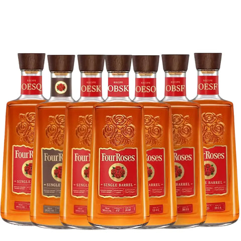 Seven bottles from the Four Roses Single Barrel Family Bundle—featuring OBSV, OBSF, OESK, OESO, OBSK, OESF, and OESQ—are lined up in a row to create an impressive tasting set. Each bottle displays the signature red label with gold roses and is topped with a wooden cap. The background is plain white.