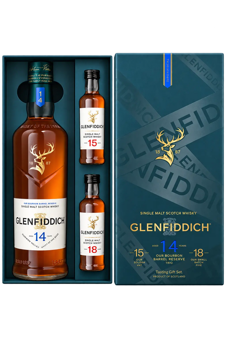 A Glenfiddich 14 Year Single Malt Scotch Whisky Limited Edition Gift Set with 15 &amp; 18 Year 50mL containing one full-sized bottle and two 50mL miniature bottles of scotch whisky, presented in a blue display box.