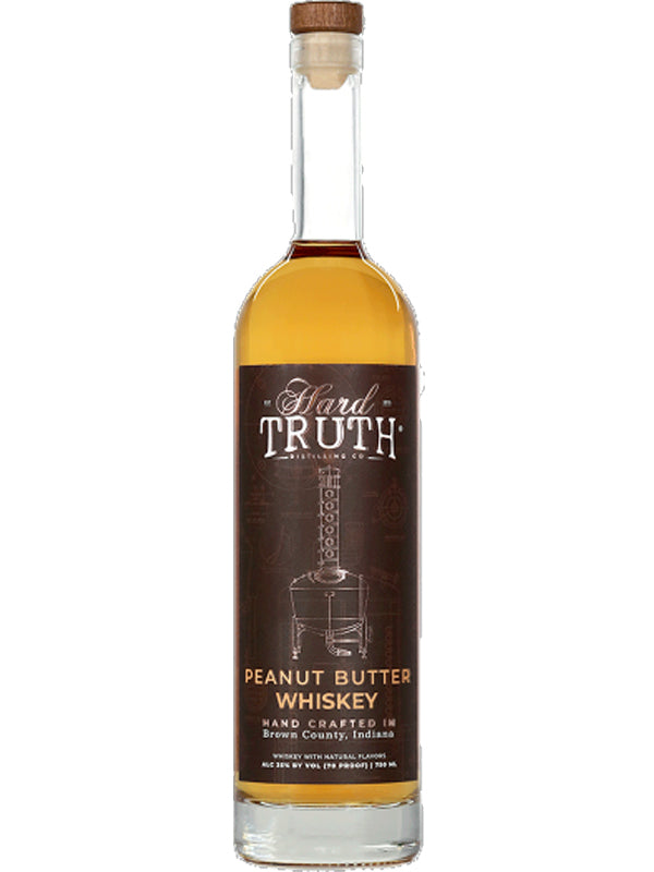 Hard Truth Peanut Butter Whiskey features a brown label with white and gold text, an illustration of a distillation apparatus, and a wooden cork—perfect for creating unique dessert cocktails.