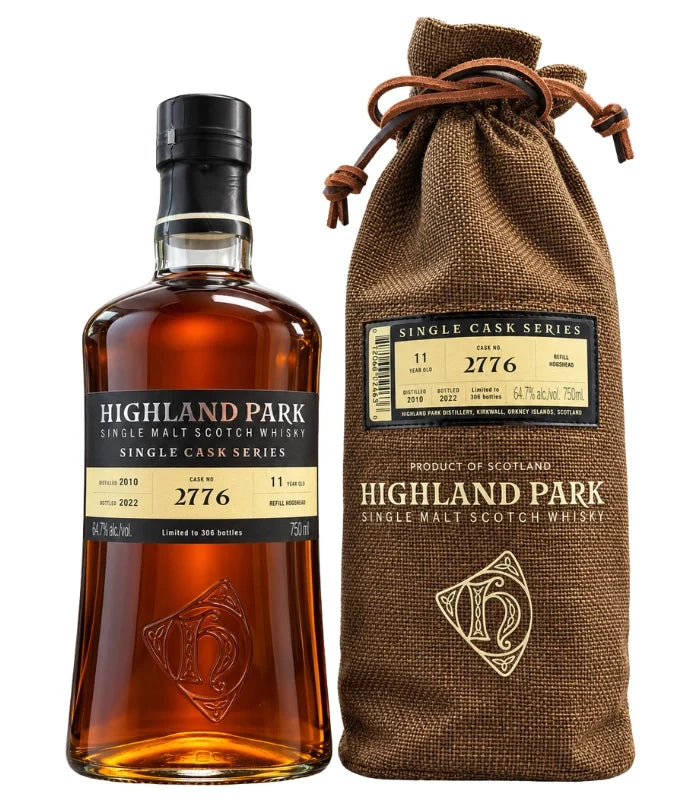 A 750mL bottle of Highland Park 11 Year Single Cask Series Scotch Whisky is shown beside a brown branded fabric bag, both displaying the cask number 2776.