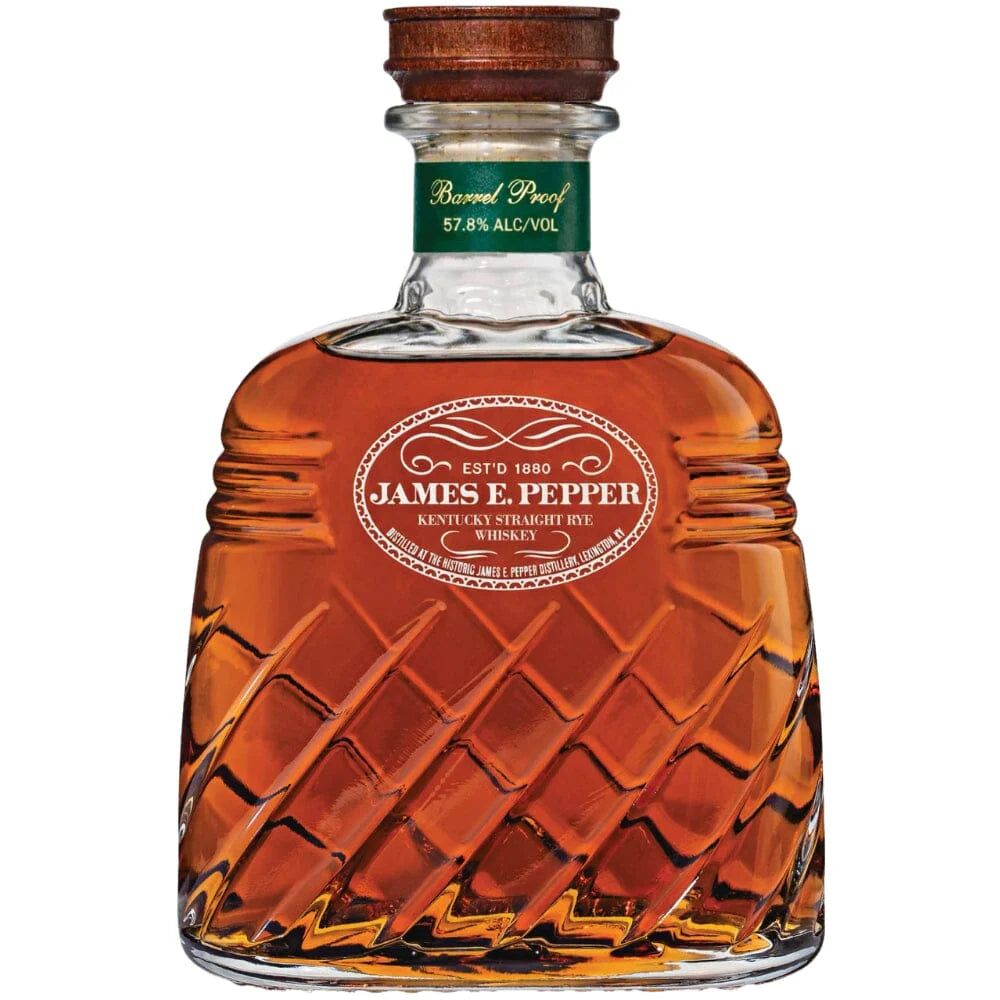 A bottle of James E. Pepper Decanter Barrel Proof Rye Whiskey, with patterned glass, an oval label, and a green neck band showing Barrel Proof 57.8% Alc/Vol.