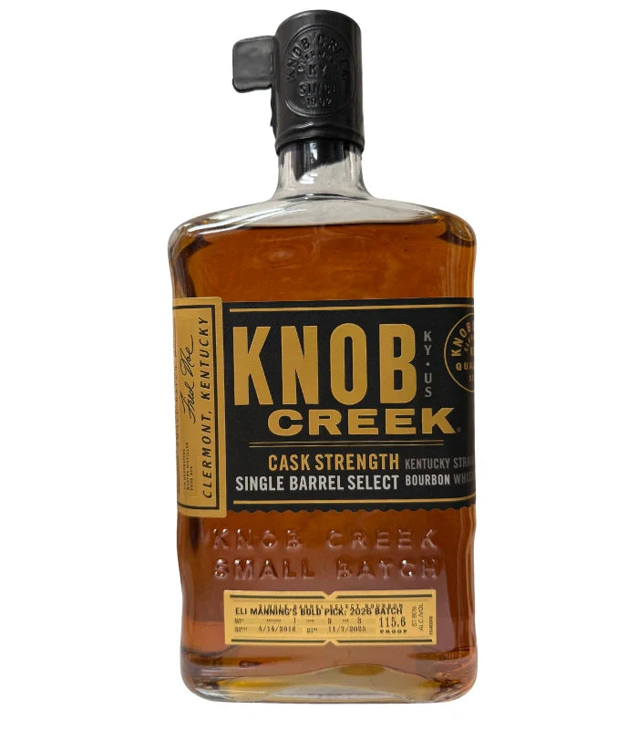 A bottle of Knob Creek "Eli Manning's Bold Pick: 2026 Batch" Cask Strength Single Barrel Bourbon features a black and gold label, Small Batch text, and a black wax-sealed cap.
