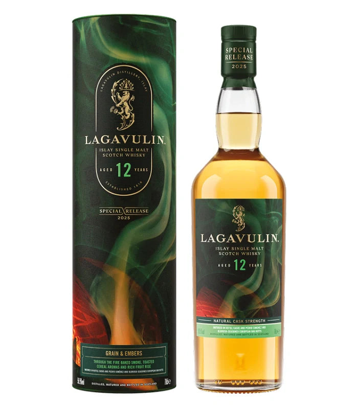 A bottle of Lagavulin 12 Year Scotch Whisky Special Release 2025 stands next to its green, black, and gold case with a swirling smoke design and product details on both the bottle and the packaging.