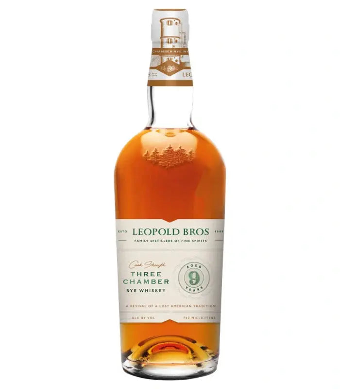 Leopold Bros 9 Year Three Chamber Cask Strength Rye Whiskey, 750ml, features a gold cap and a white-green label. This amber spirit makes a distinctive alternative to any classic bourbon gift set.