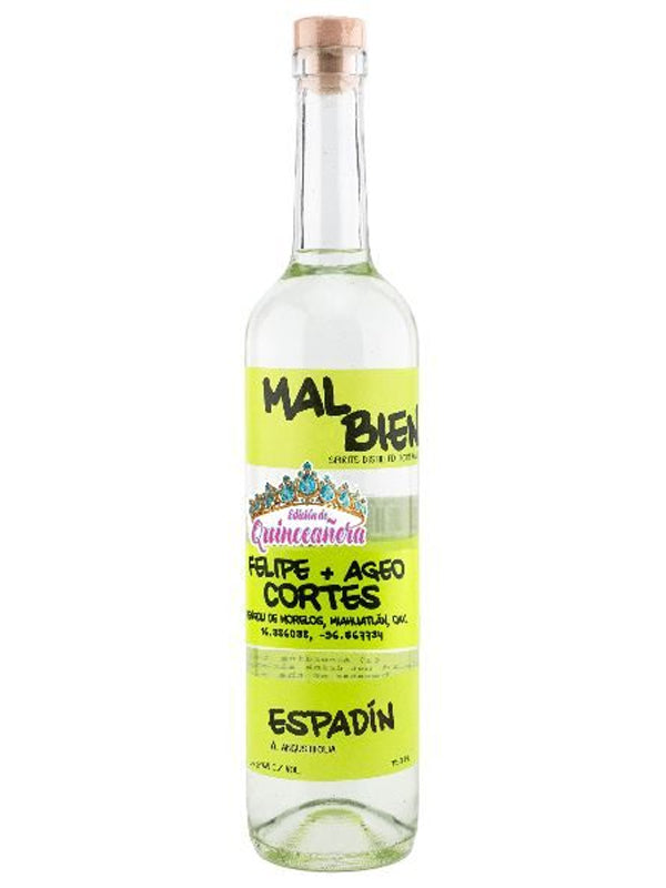 A clear glass bottle of Mal Bien Espadin Quinceanera Cortes mezcal features a yellow label with Felipe + Ageo Cortes, colorful artwork, and is sealed with a wooden cork. Made from espadín agave in Oaxaca.