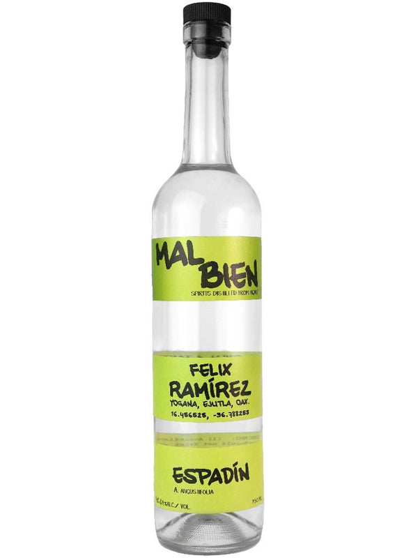 A clear glass bottle of Mal Bien Green Tape Espadin Ramirez mezcal from Oaxaca features a bright green label with black text. The liquid inside is clear.
