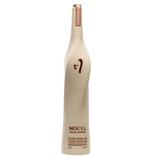 A tall, elegant cream-colored bottle with minimalist design labeled "Mocel Mezcal Artesanal Cupreata Joven 2023" in brown, featuring a simple snake illustration—this limited-edition Mocel mezcal celebrates artistry and tradition.