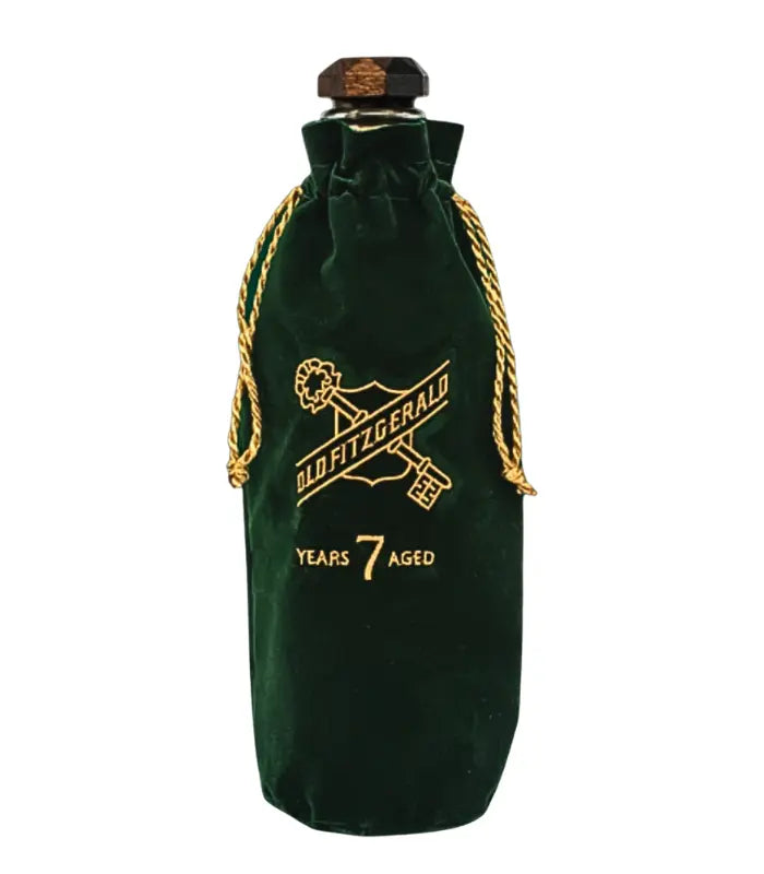 Old Fitzgerald Bottled in Bond 7 Year Old Kentucky Straight Bourbon Whiskey comes in a dark green velvet bag with gold drawstrings, embroidered with the brand logo and "Aged 7 Years" in gold—a refined presentation.
