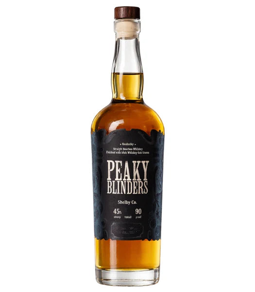 A bottle of Peaky Blinders Kentucky Bourbon Finished With Irish Whiskey Oak Staves features a black label, cork stopper, amber liquid, 45% alcohol (90 proof), and showcases classic Kentucky bourbon craftsmanship.