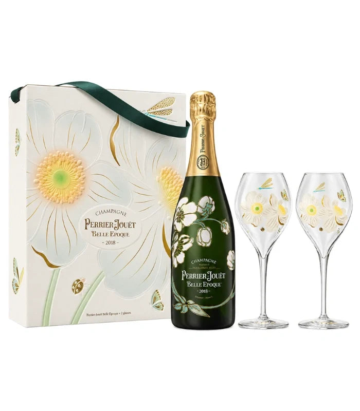 A gift set featuring Perrier Jouet 2018 Vintage Limited Edition Belle Époque Giftbox with a floral Champagne bottle, two decorated glasses, and an elegant white flower design box.