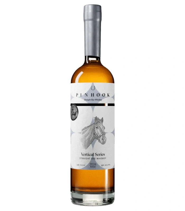A bottle of Pinhook Bourbon 10 Year Vertical Series Straight Rye Whiskey 2026 Release, with a silver cap and white label featuring a horse illustration and silver accents. The amber whiskey shines inside.