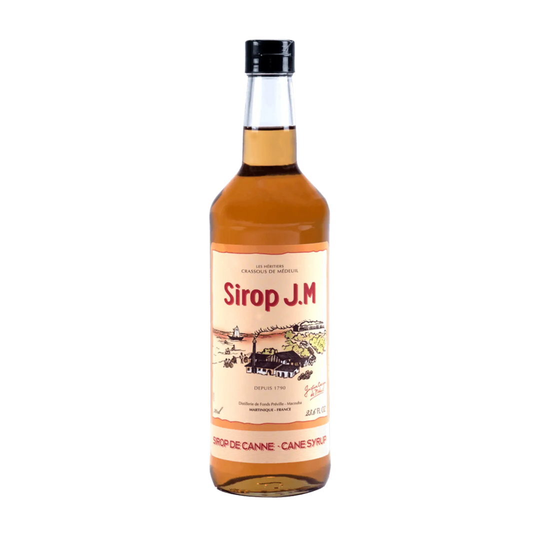A clear glass bottle of Rhum J.M. Agricole Sirop De Canne Syrup with a black cap and a label featuring red and gold accents, sugarcane field and distillery illustration, plus the product name—ideal for Ti’ Punch.