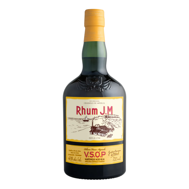 A 700ml bottle of Rhum J.M. V.S.O.P. Martinique Aged Rum with a yellow cap and distillery scene label, detailing maturation in Bourbon barrels, from the Rhum J.M brand at Habitation Bellevue.