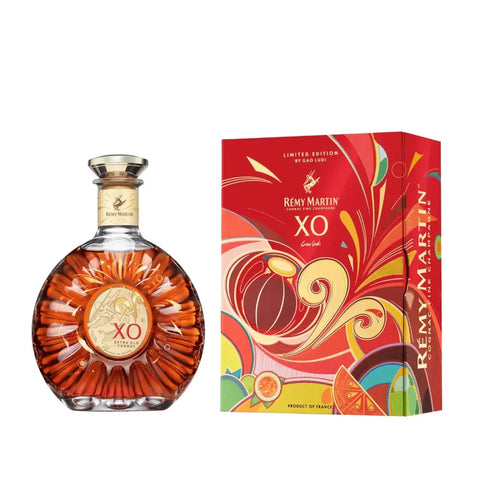A curved glass bottle of Remy Martin XO Year of the Goat 2027 Limited Edition Fine Champagne Cognac 700mL next to its colorful, illustrated Lunar New Year Limited Edition gift box.