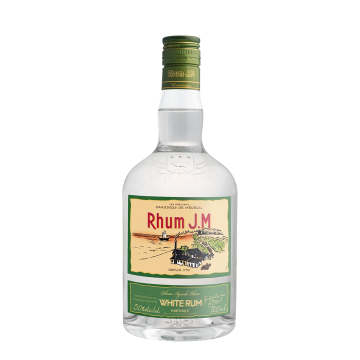 Rhum J.M. Agricole Blanc 50 White Rum comes in a clear glass bottle with a green cap and a label depicting a distillery, fields, and lighthouse. Made from premium sugarcane, it delivers an aromatic burst of tropical fruit notes.