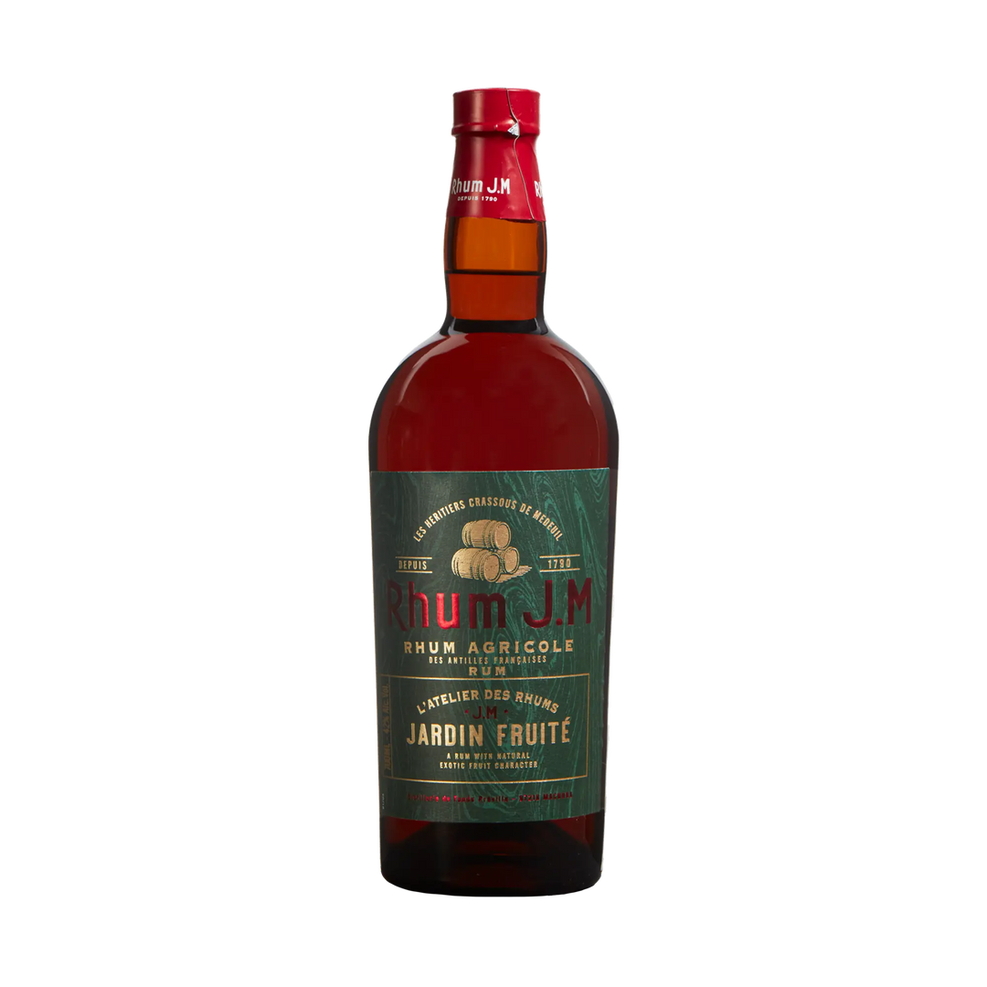 A bottle of Rhum J.M Atelier Jardin Fruité by Rhum J.M, an aged rum in French oak barrels, with a green label accented in gold and red text and a red cap, displayed against a plain white background.
