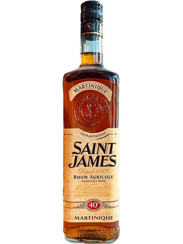 A bottle of Saint James Royal Ambre Martinique Rhum Agricole from Saint James, an AOC Martinique French Caribbean rum, with a beige and gold label, red accents, 40% ABV, black cap, and embossed logo near the neck.