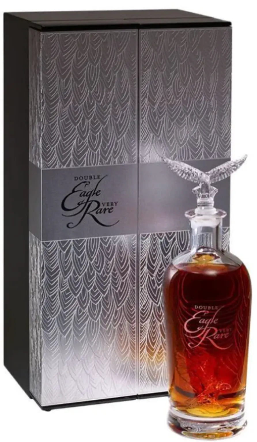 A bottle of Double Eagle Very Rare 2026 Release 20 Year Old Kentucky Straight Bourbon Whiskey by Eagle Rare, with a crystal eagle stopper, sits before an elegant silver-patterned display box with matching branding.