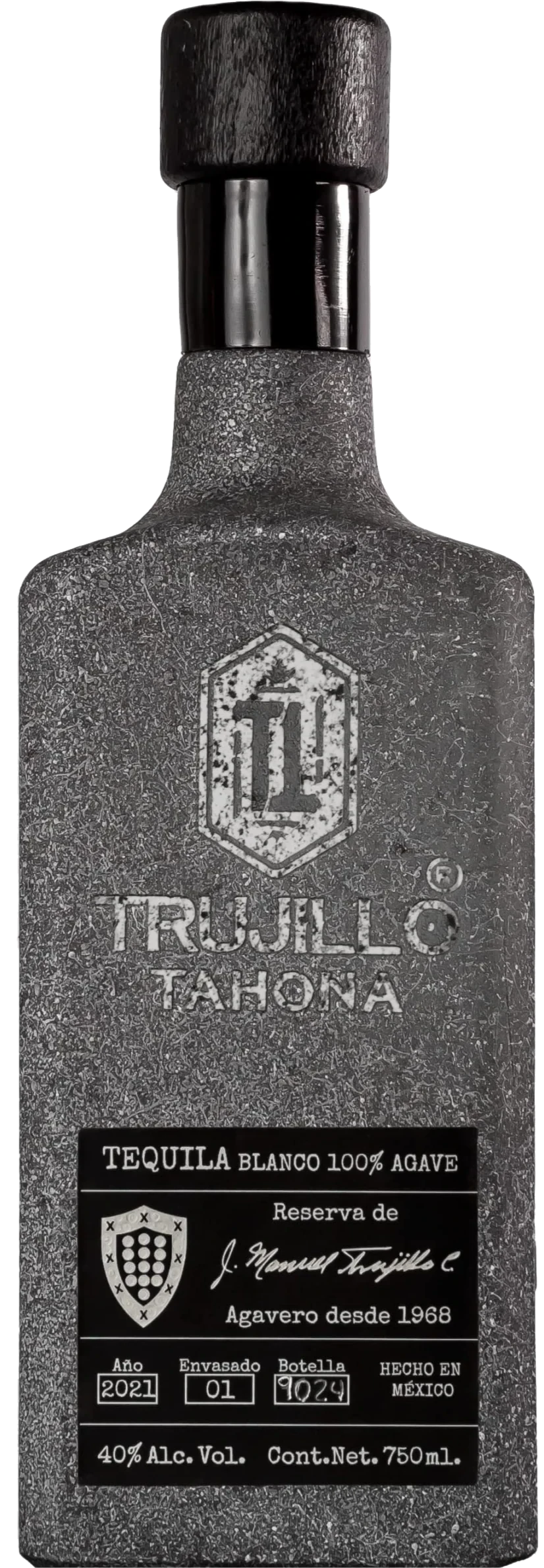 A textured dark gray bottle of Trujillo Tahona Tequila Blanco by Trujillo Tequila features a rectangular 2021 reserve label, 40% ABV, and highlights its small-batch, 100% agave Mexican origin.