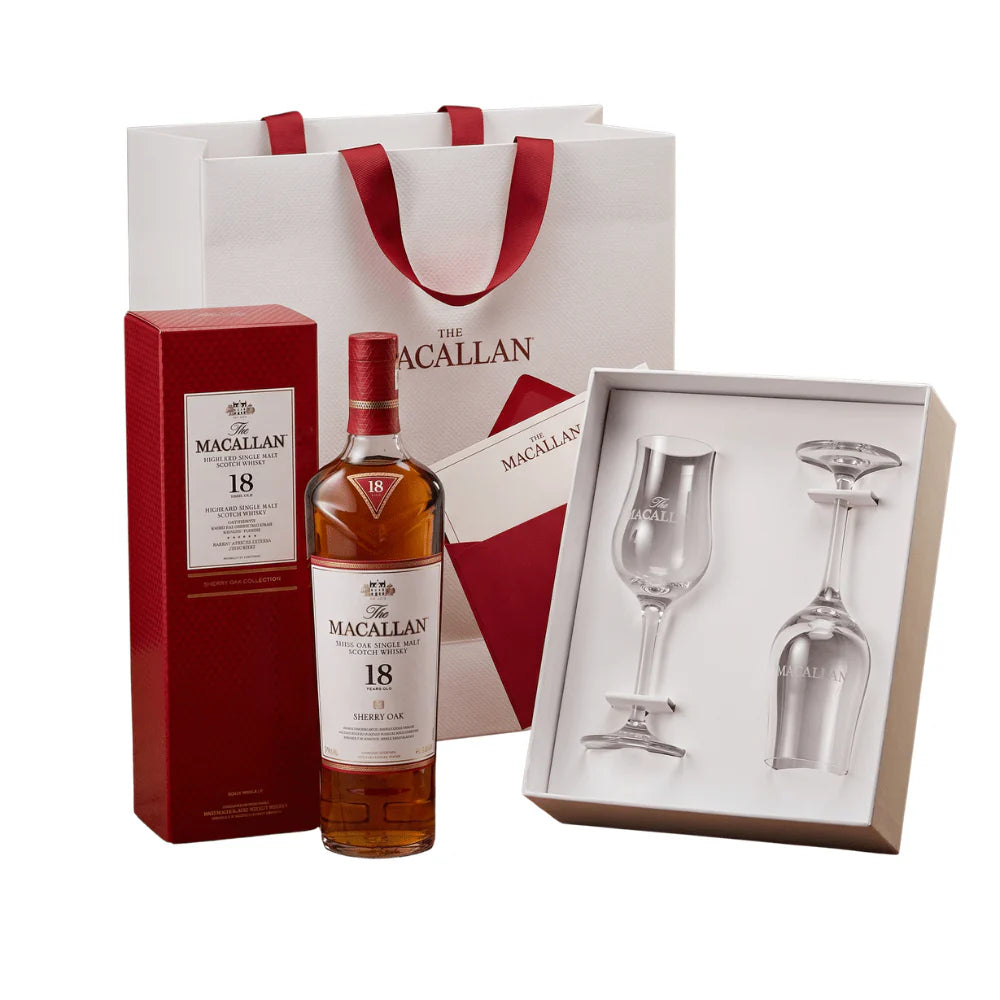 The Macallan 18 Year Old Sherry Oak Scotch Whisky Gift Set includes a bottle, two branded glasses in a presentation box, plus a white gift bag with red handles and The Macallan logo.