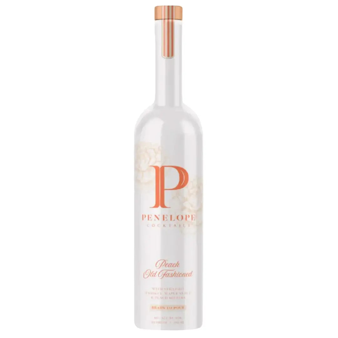 A tall white bottle with floral accents, a copper-toned cap, and elegant script displays Penelope Peach Old Fashioned by Penelope Bourbon—a ready-to-pour cocktail capturing the essence of their bourbon.