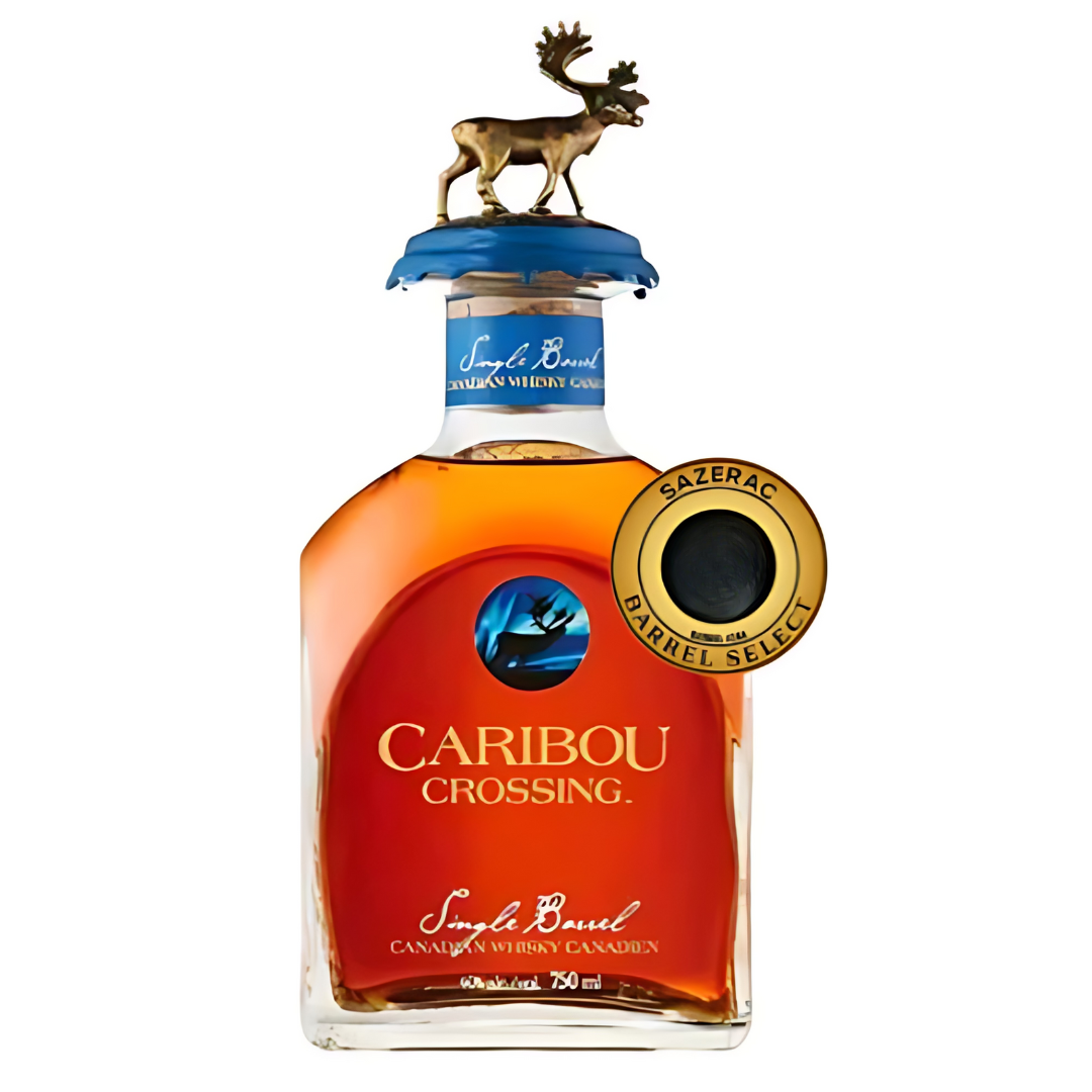 A bottle of Caribou Crossing Single Barrel Canadian Whisky Private Barrel Pick by Caribou Crossing, with a gold moose figurine on the blue cap and a Sazerac Barrel Select medallion at the neck. Label reads Single Barrel.