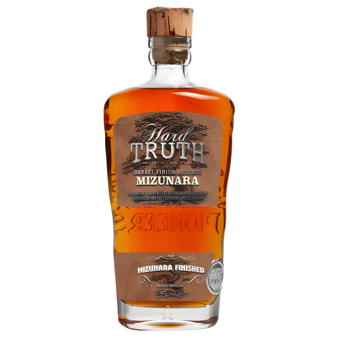 A bottle of Hard Truth Mizunara Finished Straight Wheated Bourbon Barrel Finish Reserve with a wooden cork and embossed brown label features the Hard Truth brand and product details on the front.