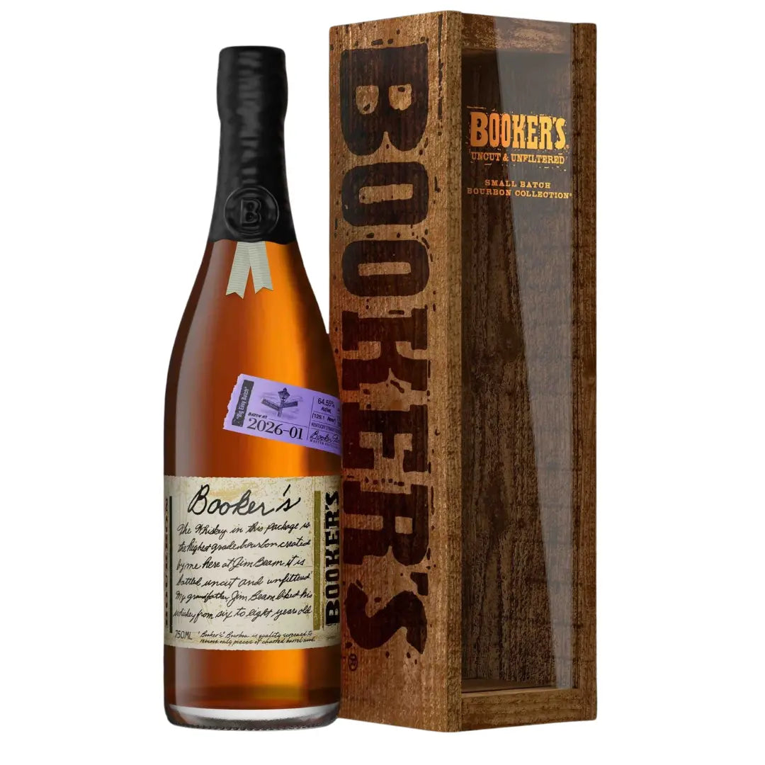 A bottle of Booker’s Bourbon 2026-01 “Big Easy Batch” by Booker's, barrel strength with a black wax seal, rests beside a tall wooden display box featuring the Booker’s logo and clear panel—ideal for this limited release.