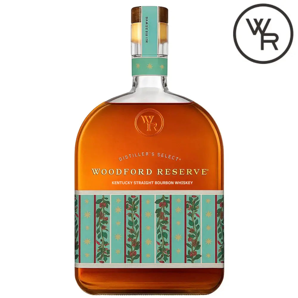A bottle of Woodford Reserve Holiday Edition Bourbon 2025 “Designed by Markarian,” featuring a limited edition teal and gold floral label with the circular WR logo in the top right corner.