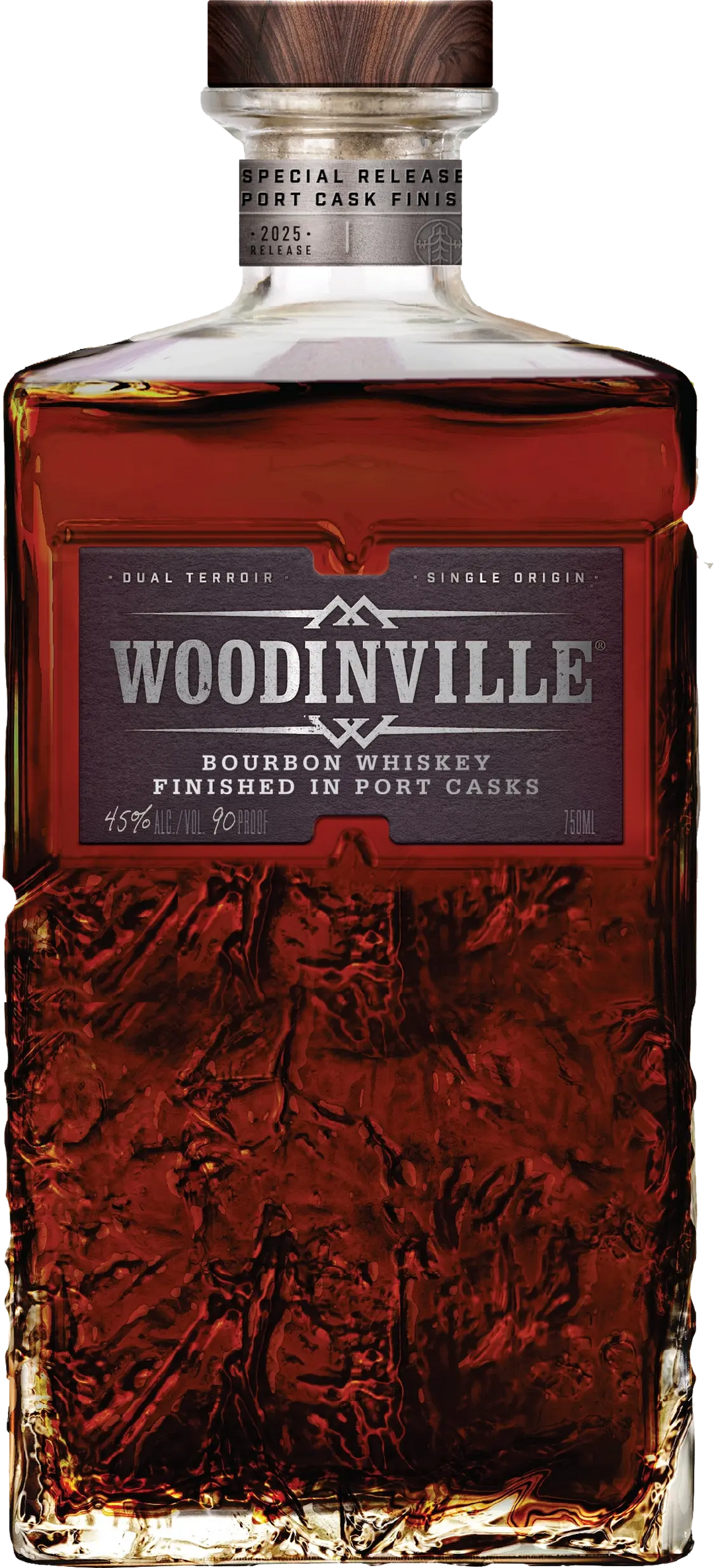 A bottle of Woodinville Port Finished Straight Bourbon, a straight bourbon whiskey from Woodinville, finished in ruby port casks. The label reads Special Release and indicates 45% ALC/VOL (90 PROOF), while the glass features a textured pattern on its lower portion.