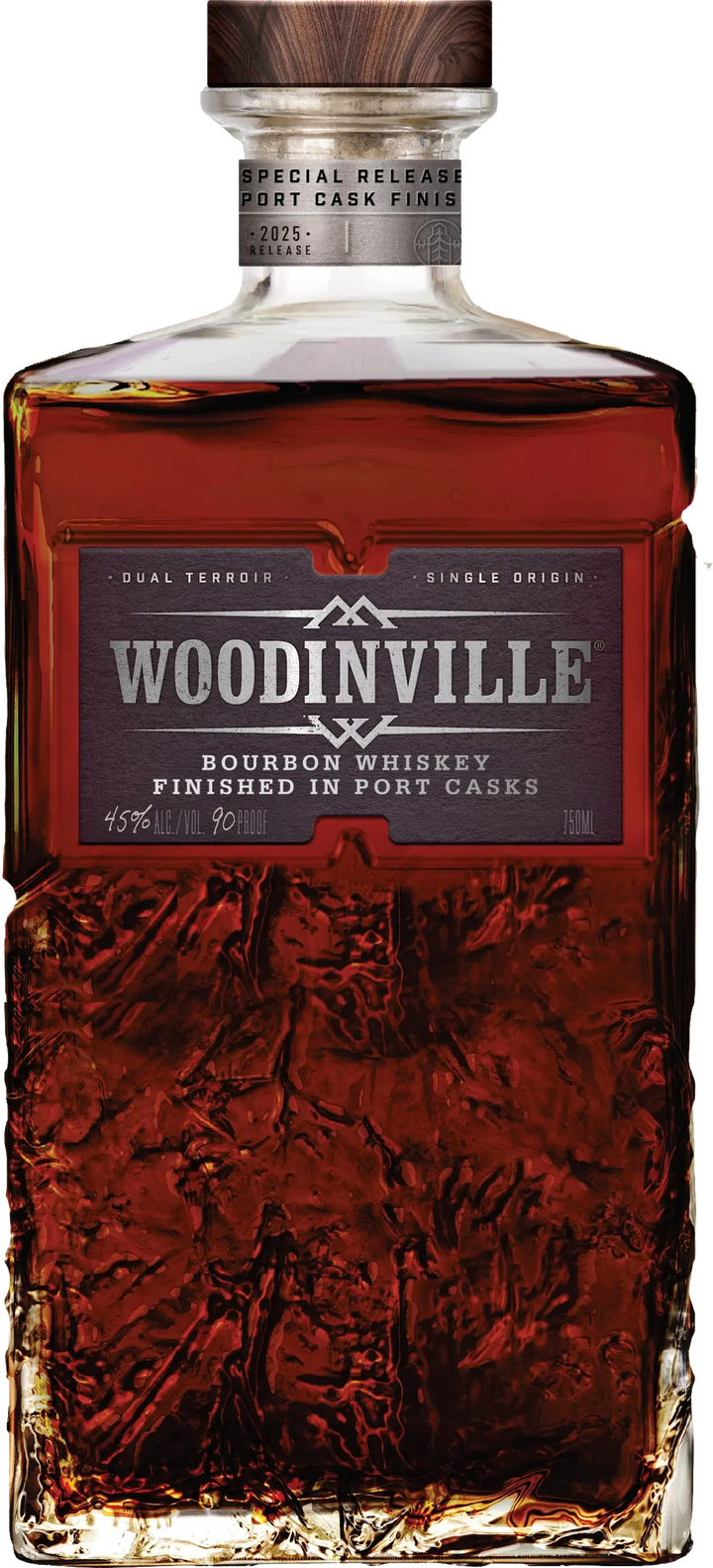 A bottle of Woodinville Port Finished Straight Bourbon, a straight bourbon whiskey from Woodinville, finished in ruby port casks. The label reads Special Release and indicates 45% ALC/VOL (90 PROOF), while the glass features a textured pattern on its lower portion.