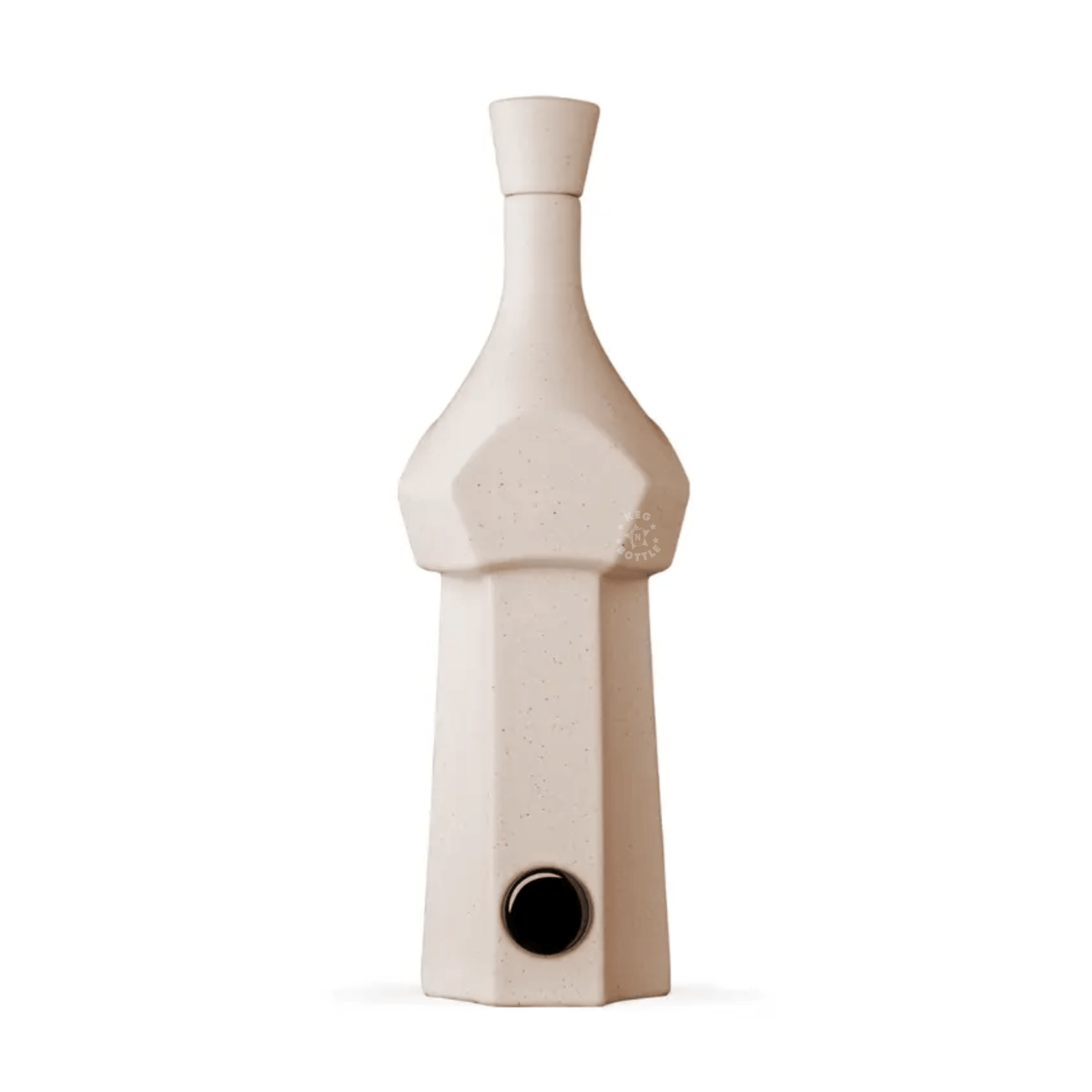 A tall, beige geometric ceramic bottle with a narrow neck and small round spout captures the artistry of Casa Obsidiana Blanco Tequila (750 ml) by Casa Obsidiana—crafted from 100% blue Weber agave in Jalisco—on a plain white background.