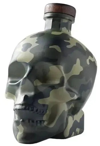 The Crystal Head Vodka Camo “Land Of The Free” Deep Etch Custom Bottle features a human skull shape with a bold camouflage design and a wooden cap.