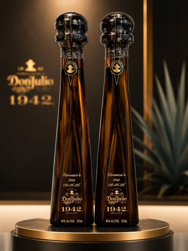 Two custom engraved Don Julio 1942 tequila bottles with personalized 21st birthday engraving