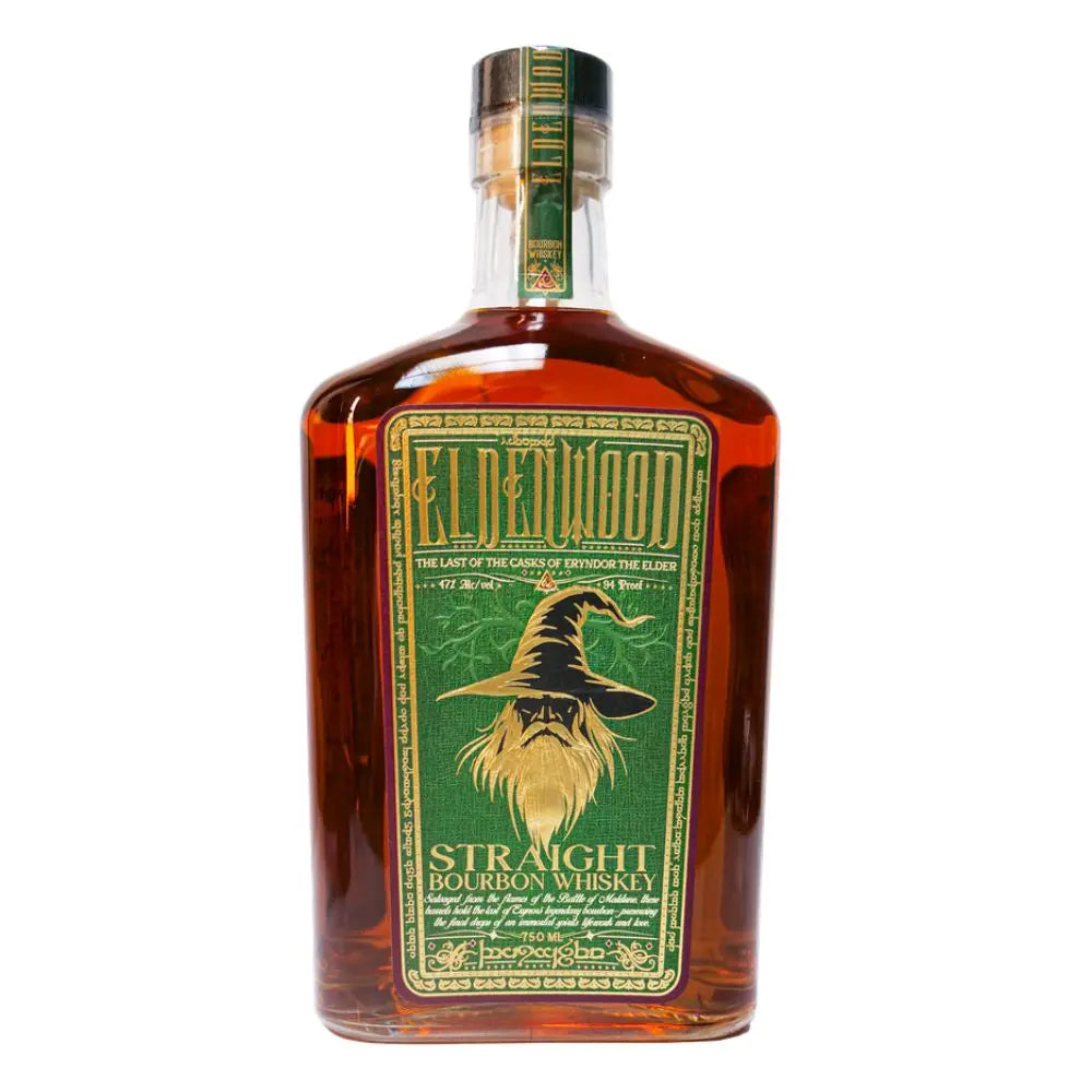 A bottle of Eldenwood Straight Bourbon Whiskey features a green and gold label with Eryndor the Elder, a bearded wizard in a pointed hat. The whiskey inside has a rich amber color.