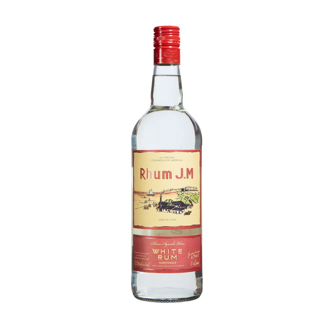 A clear glass bottle of Rhum J.M. Agricole Blanc 110 Proof White Rum features a red cap and cream and red label with a distillery illustration and gold text, photographed on a plain white background.
